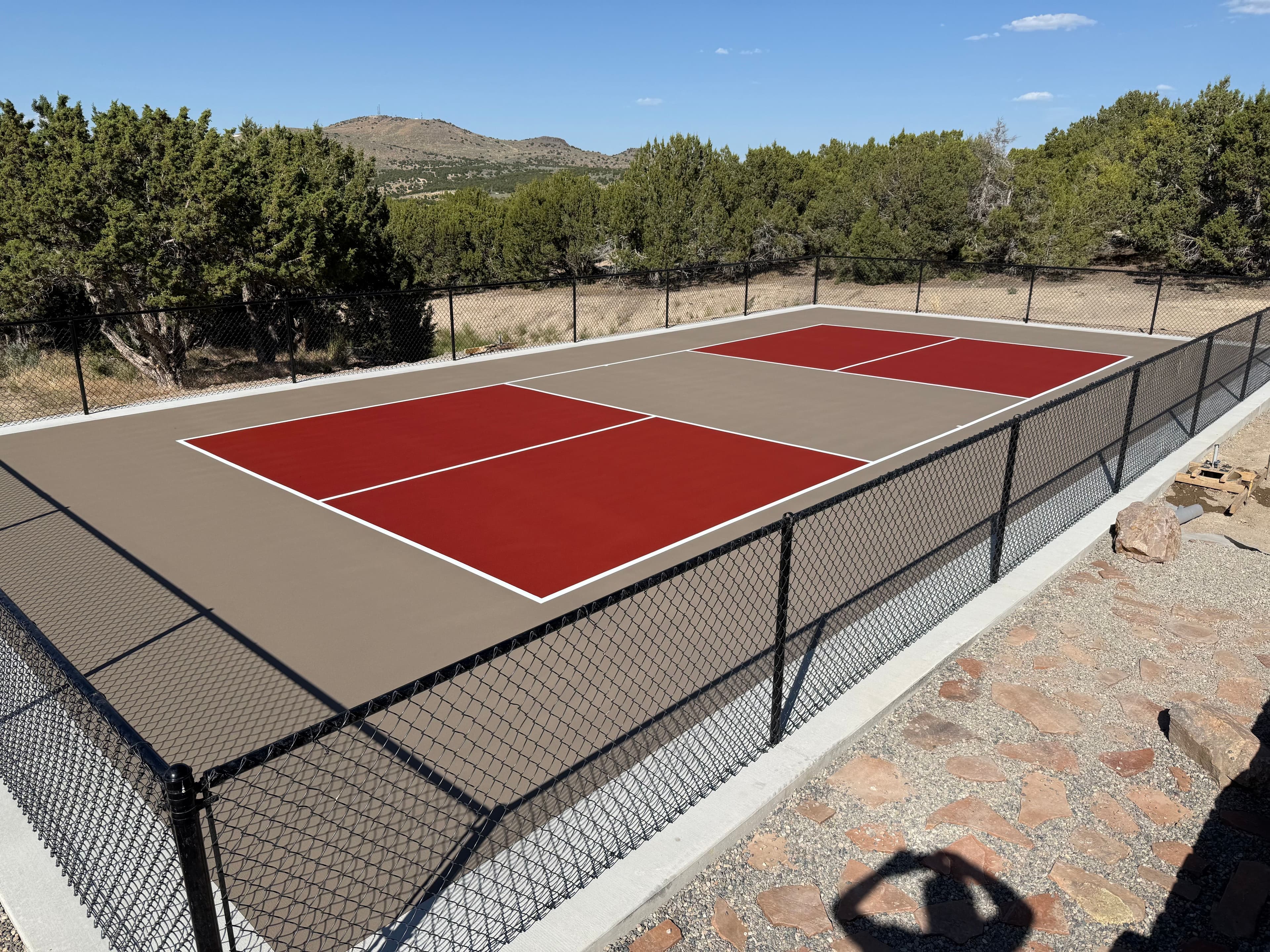 Desert-toned court with rock border